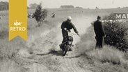 Motorradsportler beim Geländerennen um die Deutsche Meisterschaft 1961  