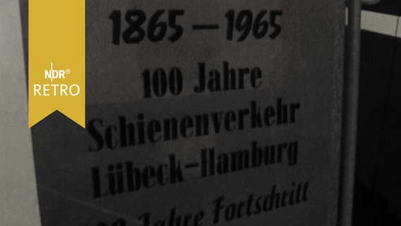 Ausstellungsplakat zu "100 Jahre Schienenverkehr Lübeck - Hamburg. 1865 - 1965"  