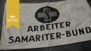 Transparent mit Logo und Aufschrift "Arbeiter Samariter-Bund" (1961)  