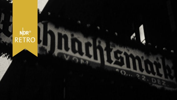 Schild "Weihnachtsmarkt" mit Tannenumkränzung (1961)  