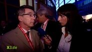 Caro Korneli im Gespräch mit Thomas de Maizière.  