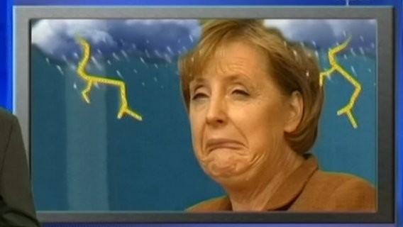 Angela Merkel zieht eine Fratze  