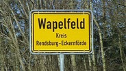 Ortsschild von Wapelfeld  