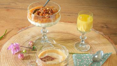 Panna cotta with rhubarb compote and walnut brittle, a glass of egg nog and a cup of coffee, served on a slice of tree.  © NDR/doclights Photo: Marc Vorwerk