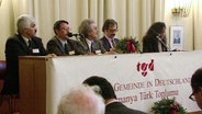 Das Podium beim Gründungstreffen der Türkischen Gemeinde in Deutschland 1995  