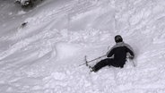 Skifahrer im Tiefschnee  