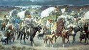 Dieses Bild wurde 1942 von Robert Lindneux gemalt. Es erinnert an das Leid des Cherokee-Volkes unter der Zwangsumsiedlung. Die Cherokee-Indianer nannten diese Reise wegen ihrer verheerenden Auswirkungen die "Spur der Tränen". Auf dem Zwangsmarsch waren die Migranten mit Hunger, Krankheiten und Erschöpfung konfrontiert. Über 4.000 der 15.000 Cherokees starben. © picture-alliance / newscom / Picture History 