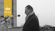 Redner (wahrscheinlich Jean-Aime Dolidier) bei der Einweihung der Gedenkstätte Neuengamme, 07.11.1965. © NDR Archiv Screenshot 