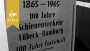 Schild am Lübecker Bahnhof "1865-1965 - 100 Jahre Schienenverkehr Lübeck-Hamburg". © NDR Archiv Screenshot 