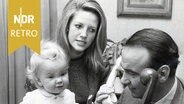 Familie am Telefon © IMAGO / ZUMA Wire 