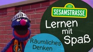 Grobi mit dem Logo "Lernen mit Spaß" © NDR/Sesamstraße Foto: Grafik