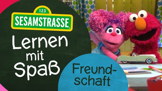 Abby und Elmo mit dem Logo "Lernen mit Spaß" © NDR/Sesamstsraße Foto: Grafik
