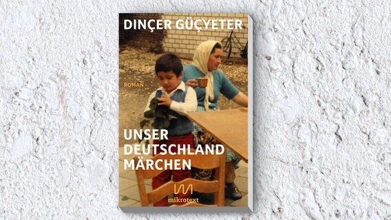 Cover von "Unser Deutschlandmärchen" von Dinçer Güçyeter © Mikrotext Verlag 