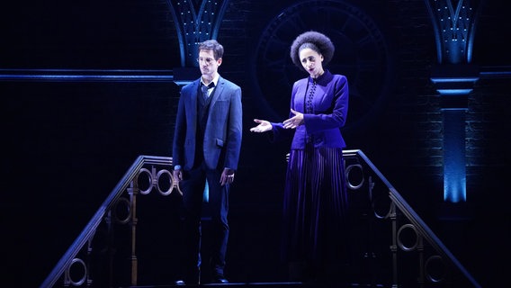 Marcus Schoettle (top back right) as Harry Potter and actress Gillian Anthony (top back l) as Hermine Granger standing on the stairs in a scene 
