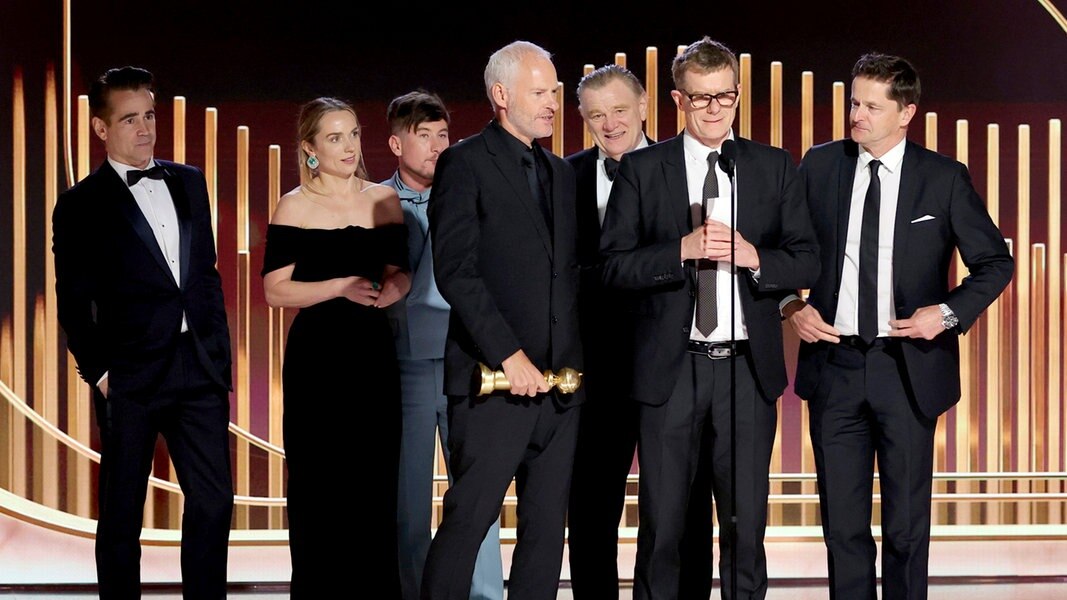 Martin McDonagh (Mitte) und sein Filmteam mit Schauspieler Colin Farrell um 