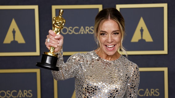Director Sian Heder receives an Oscar for Best Adapted Screenplay 