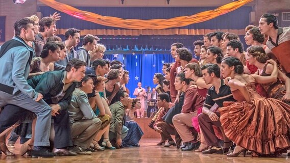 Two groups of dancers look at each other in a challenging way - scenes from the movie "History of the West Side" by Steven Spielberg © 2020 Twentieth Century Fox Film Corporation.  Photo: Niko Tavernise