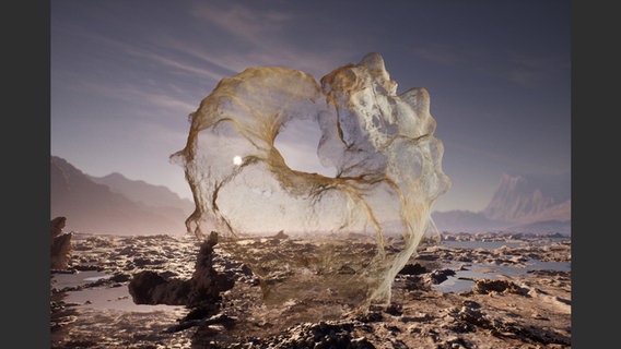 Ein Foto einer Wüstenlandschaft, in der Wasser mit Sand zu einem fest scheinenden Gebilde aufgeworfen wird. © Courtesy the artist Foto: Jakob Kudsk Steensen