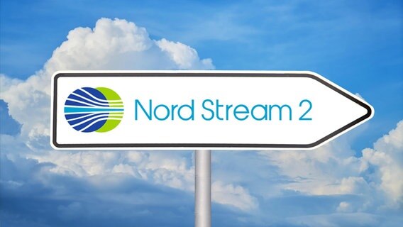Nord Stream 2 road sign with logo against blue sky © picture alliance / CHROMORANGE Photo: Udo Herrmann