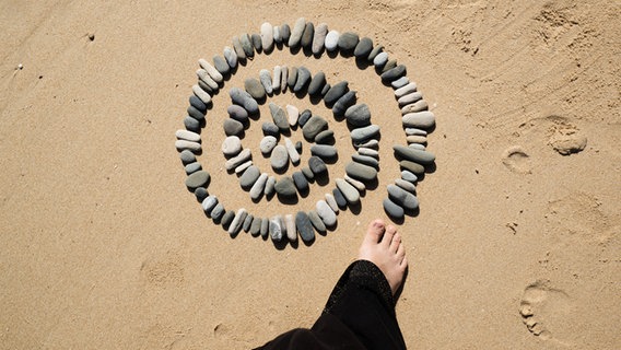 Eine Spirale aus Kieselsteinen © Seleneos / photocase.de Foto: Seleneos