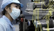 Ein Mitarbeiter in einem Forschungs- und Produktionsunternehmen für Lithium-Ionen-Batterien in Huaibei, Provinz Anhui, China. © Imago 