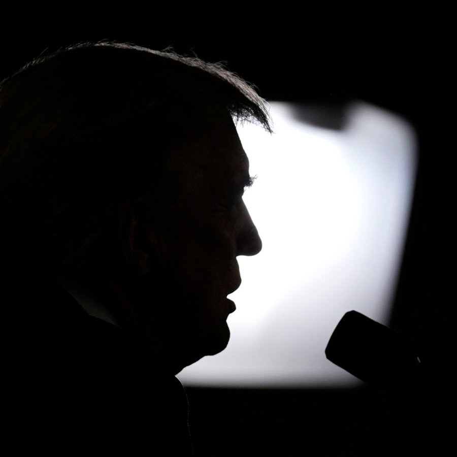 Donald Trump bei einem Event in Las Vegas, sein Kopf ist im Schatten. © picture alliance Foto: John Locher