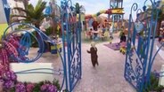 Szene aus einer Sesamstraßenfolge:Tanzende Kinder auf einem Spielplatz (Screenshot).  