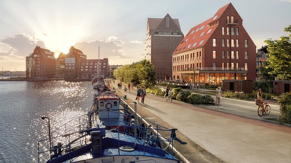 Das Bild zeigt eine animierte Version des fertigen Speichers am Rostocker Stadthafen - bei schönstem Wetter erhebt sich das schlichte, quadratische Gebäude mit seinen zahlreichen kleinen Fenstern wie eine Festung an der Kaikante in den Himmel. © PMR 