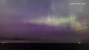 Polarlichter über dem Bülker Leuchtturm in Strande. © Carsten Jonas 