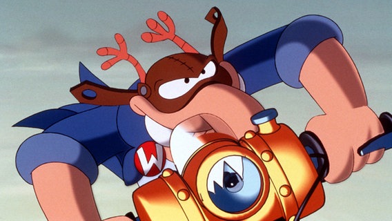 Comic-Kultfigur Werner "kachelt" im neuen Kinofilm "Volles Rooäää!!! Fäkalstau in Knöllerup" mit seinem Motorrad, der "Satten Literschüssel" durch die Gegend (Screenshot) © picture-alliance / dpa Foto: dpa-Film Constantin