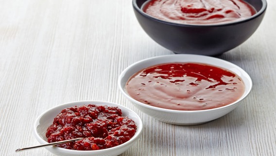 Three bowls of red barbecue sauces.  © COLOURBOX Photo: COLOURBOX