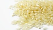 Risotto-Reis auf einer weißen Fläche. © djama/fotolia Foto: djama