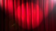 Eine Bühne mit geschlossenem Vorhang. © Colourbox Foto: -