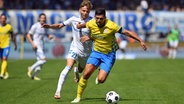 Spielszene Eintracht Braunschweig (gelb) gegen Magdeburg © picture alliance/dpa 