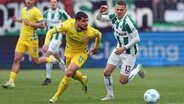 Spielszene Preueßen Münster (weiß) gegen Eintracht Braunschweig © picture-alliance / DPA 