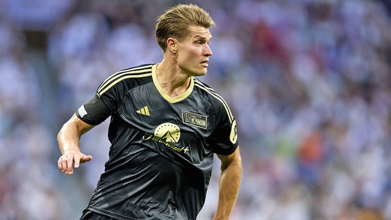 Kevin Behrens von Union Berlin im Duell mit Real Madrid in Aktion © IMAGO / PanoramiC 