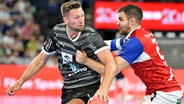 Harald Reinkind (l.) vom THW Kiel am Ball © Jan Kirschner 