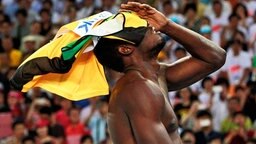 Sprinter Usain Bolt ist enttäuscht. © dpa Foto: Diego Azubel