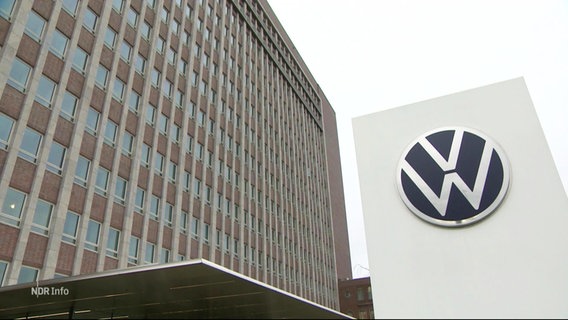 Das VW-Logo und die Fassade eines Hochhauses. © Screenshot 