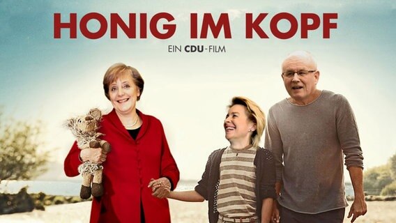 Filmplakat: Honig im Kopf mit Merkel, Kauder und von der Leyen.  