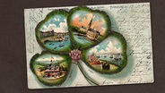 Auf einer historischen Postkarte ist ein Kleeblatt abgebildet.  